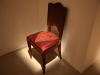 Napperon furtif, 2022, installation, chaise en bois et cuir, sumac, dimensions variables