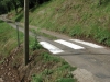 Passages protégés, 2006, installation, deux passages protégés sont installés dans les rues étroites et sans trottoir d’un village. Un congrès de lucioles, une exposition hors-les-murs du Mamco, Genève, Suisse,  produite par Les Ateliers des Arques, Les Arques, France, 2006. Photos © Tami Notsani